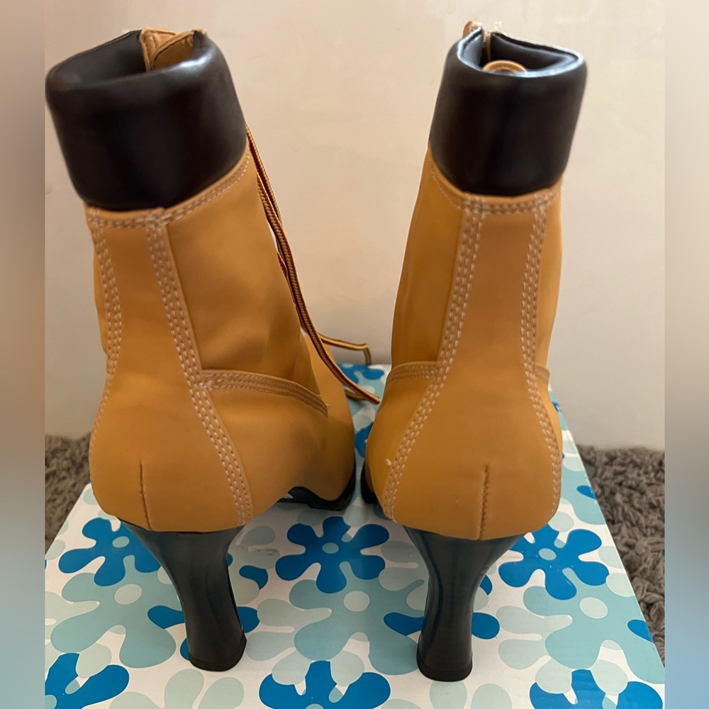 Women’s heeled boots size 7.5.  New never worn.